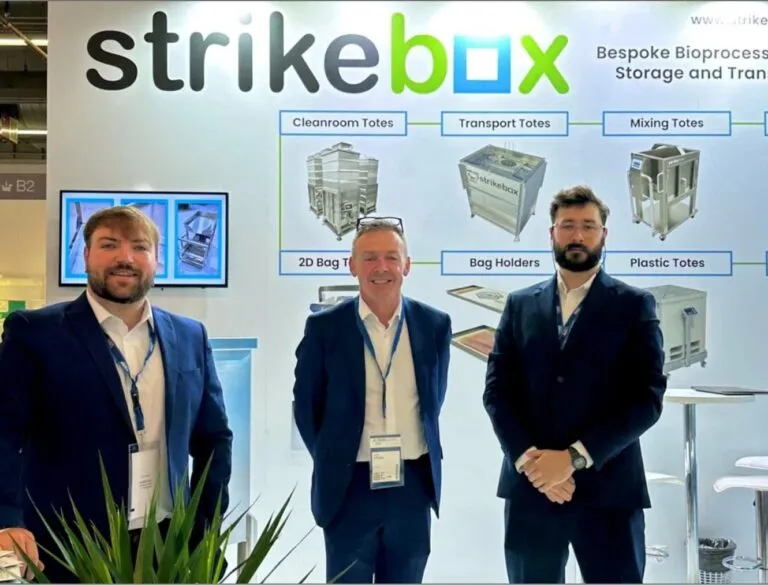strikebox team in front of stand