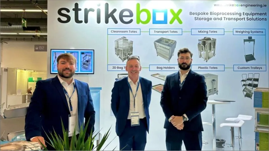 strikebox team in front of stand