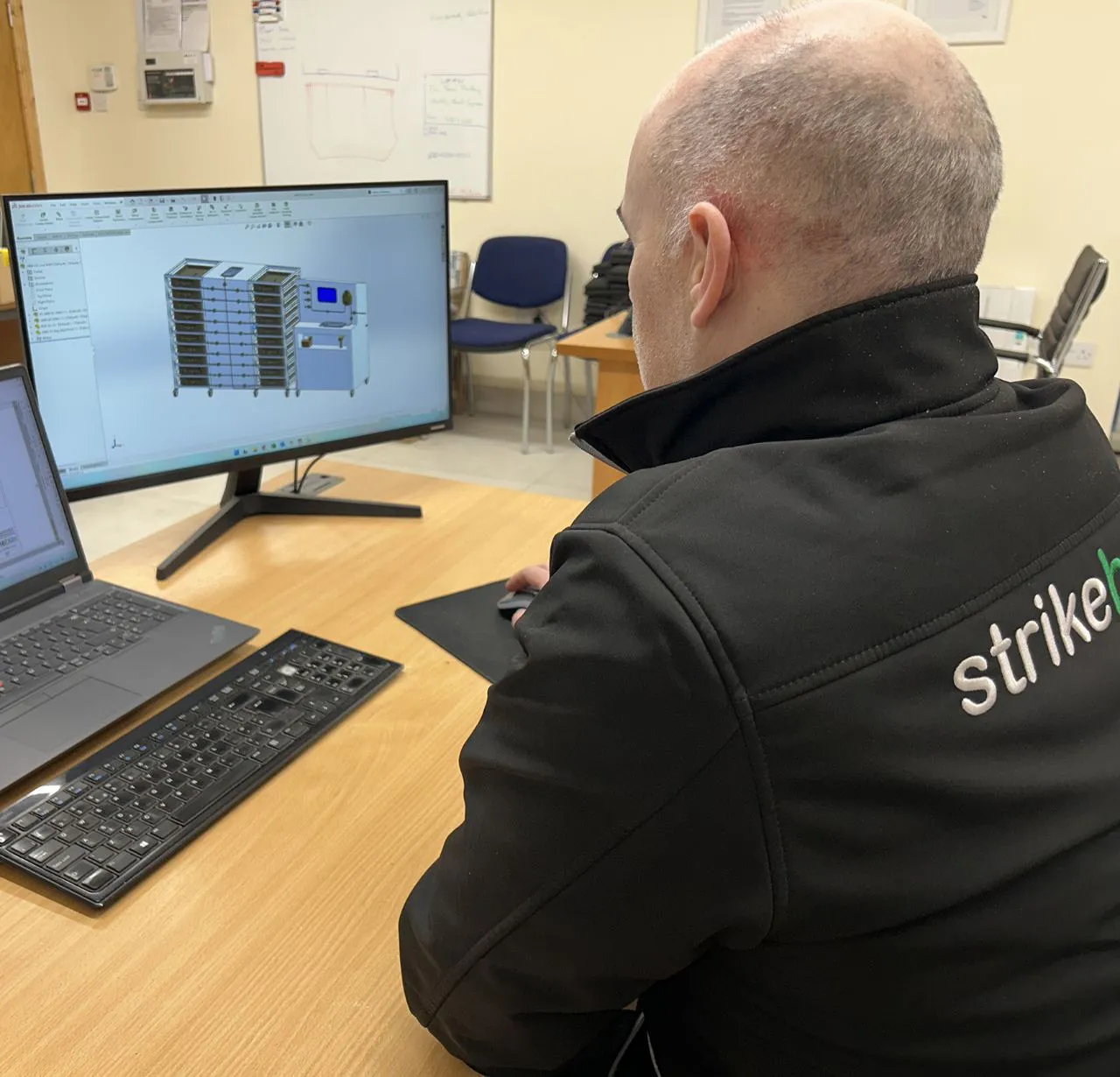 engineering design employee staring at laptop