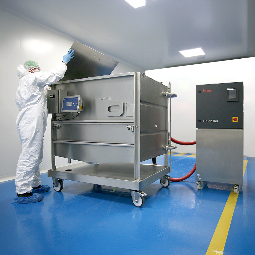 technician opening panel of cleanroom heating cooling tote